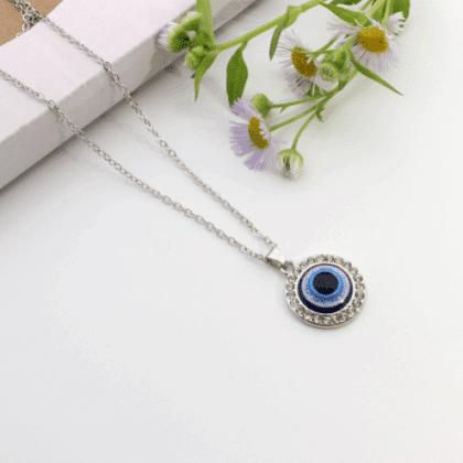 Necklace Blue Eye of Protection Circle, a necklace with a blue eye pendant and a small purple flower